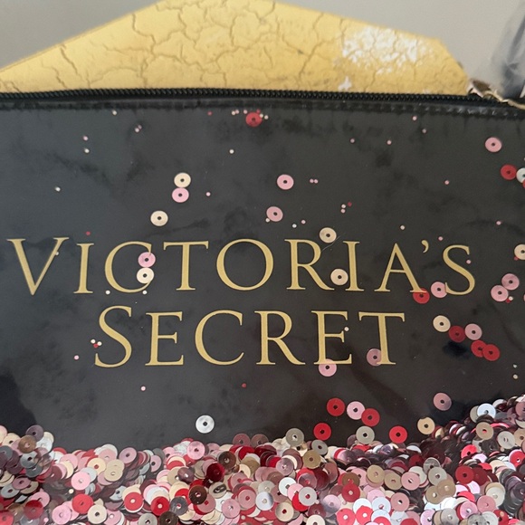 Victoria's Secret Black Clutch with Pink Sequins
NWOT - Picture 5 of 5